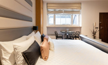 Apart Hotel Triple Room Picture with Bed and Sofa